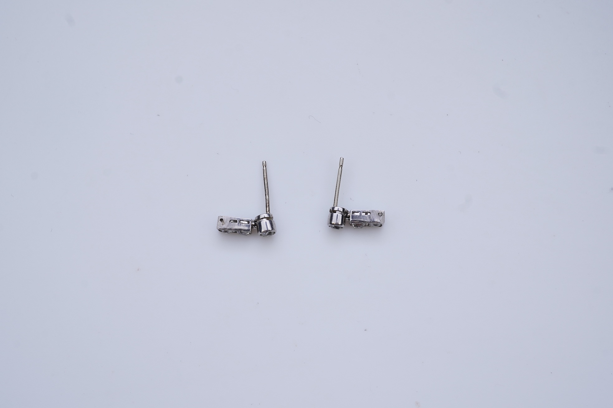 A pair of diamond earrings, early 20th century composite